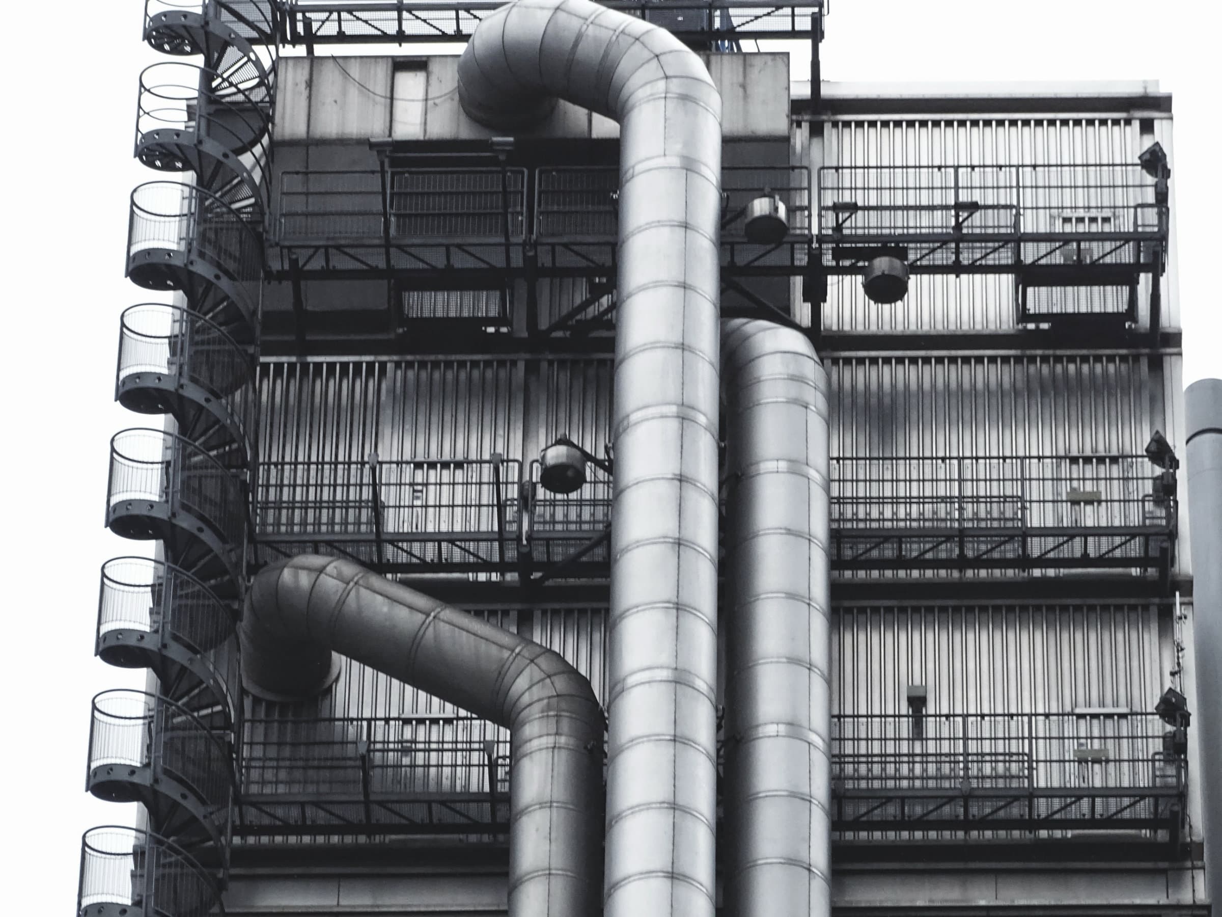 Air cooled chiller units and pipework on a rooftop plant deck